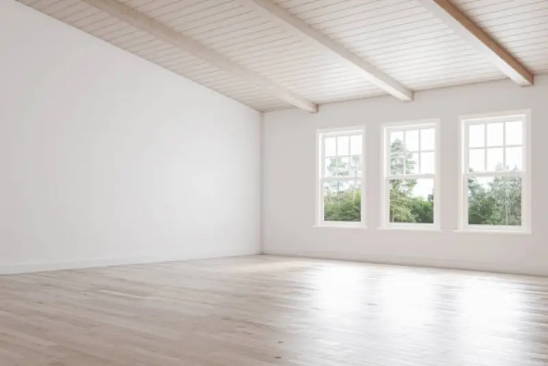 An elegant and warm bedroom virtually staged in a soft Scandinavian style generated with AInteriors interior design app, compared to the empty original.